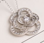 ELSIE LOVE Camélia Necklace Women 18K Gold Plated V Gold Zirconia PVD 5x Layered Hollow Flower Pendant - Image 4